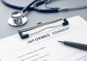 Informed Consent form with stethescope and pen